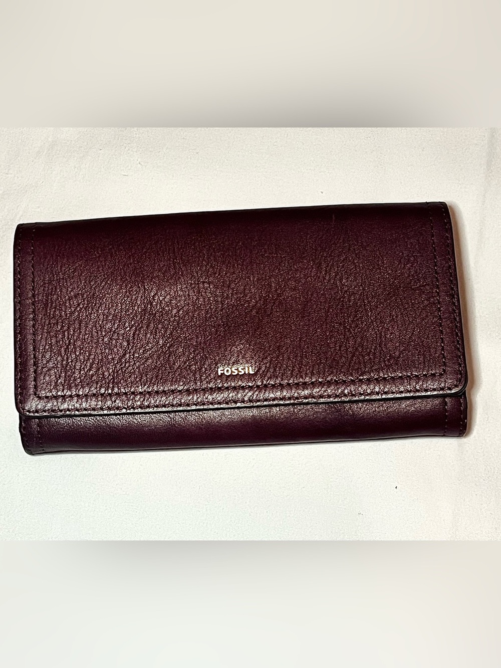 dark purple leather Logan RFID Flap wallet by Fossil